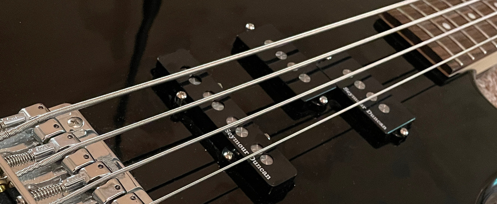 A black 4 String Bass with Seymour Duncan Quarter Pound PJ pickups installed