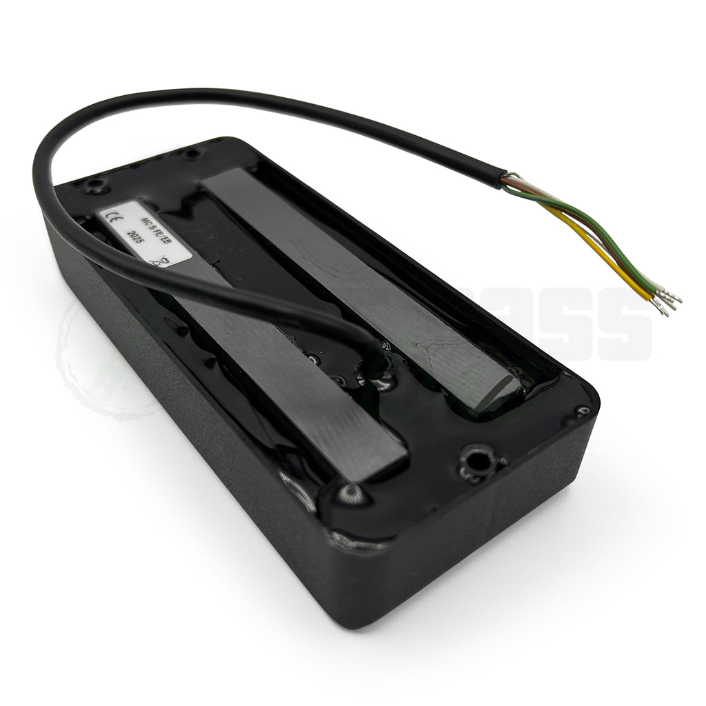 back side view of the Delano MC5 FE/EB 5 String Dual Coil Ernie Ball® USA Pickup showing the input of the wiring cable into an epoxy back on the pickup shell