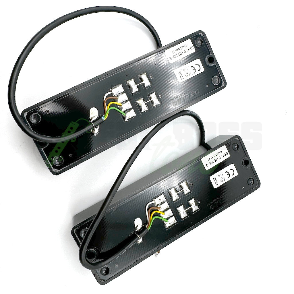 photo of the back of the Delano SBC6 HE/M2-E 6 String Bass Pickups shot from the top, showing the four pickup wires exiting the back of the pickup