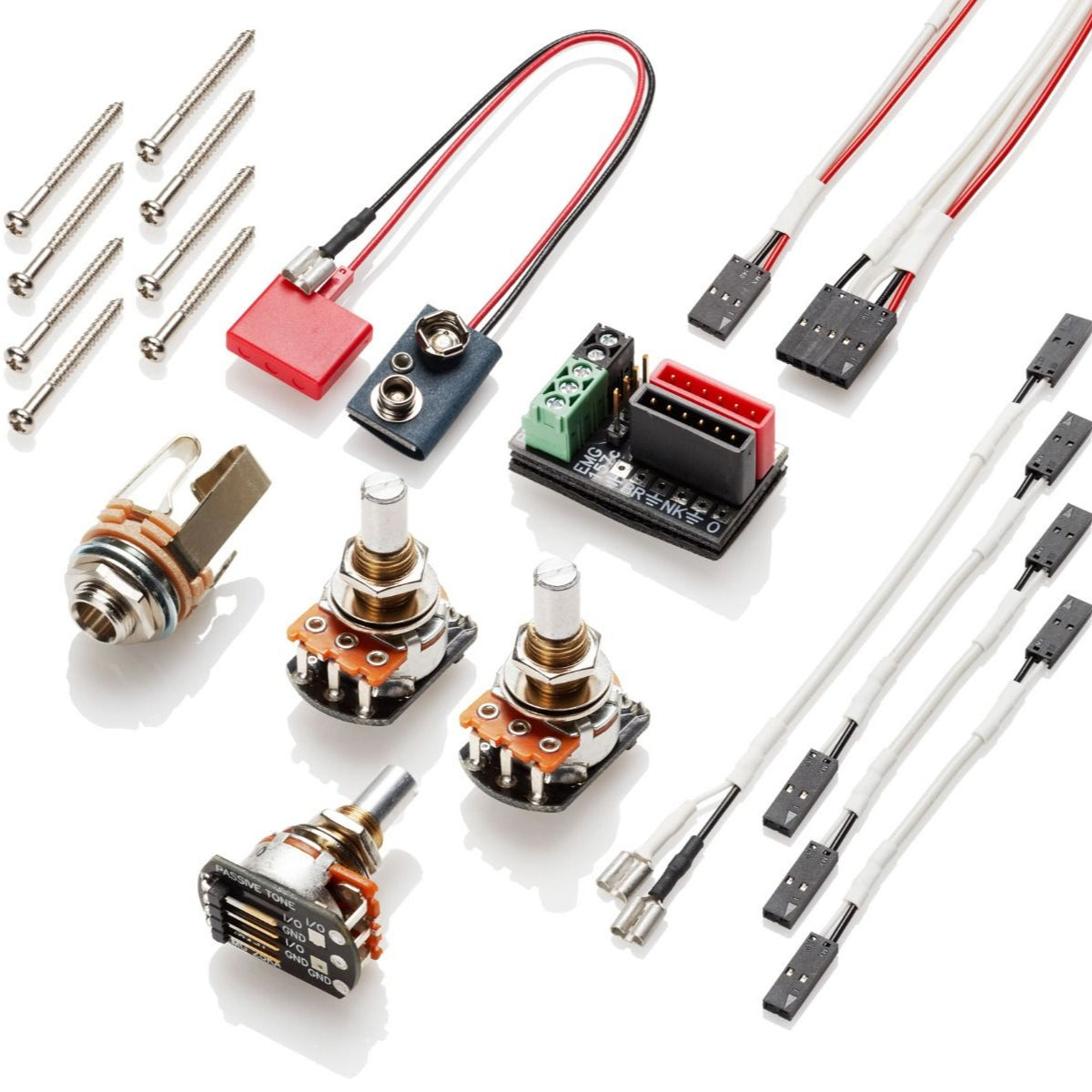 View of all included items with a set of EMG E4W bass soapbar pickup, including pots, jack, and solderless connector cables.