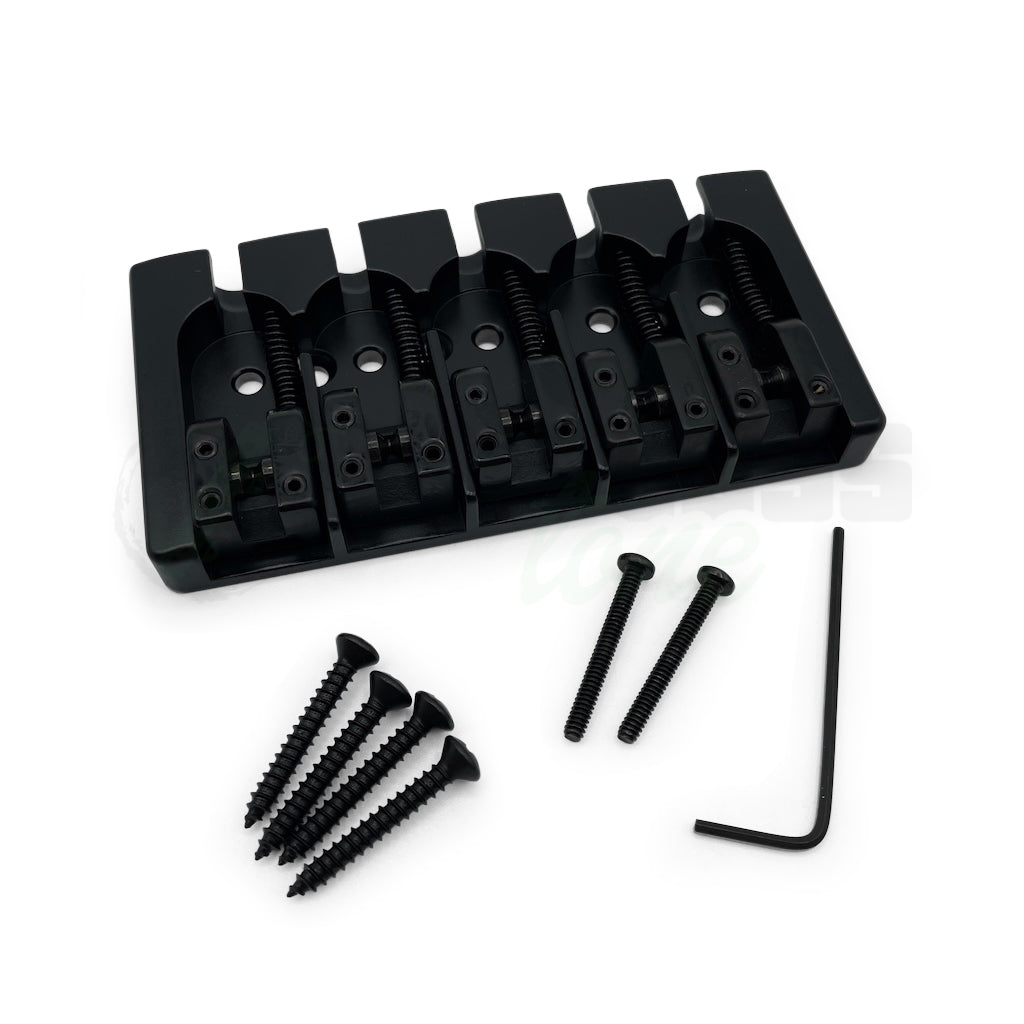 photo of the black version of the Hipshot A Style Fender® Mount Bass Bridge for 5 string showing the included 4 mounting screws, allen wrench and extra intonation screw