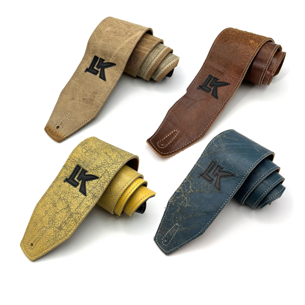 Group of four LK Straps Leather Bass Straps showing light brown dark brown yellow and teal