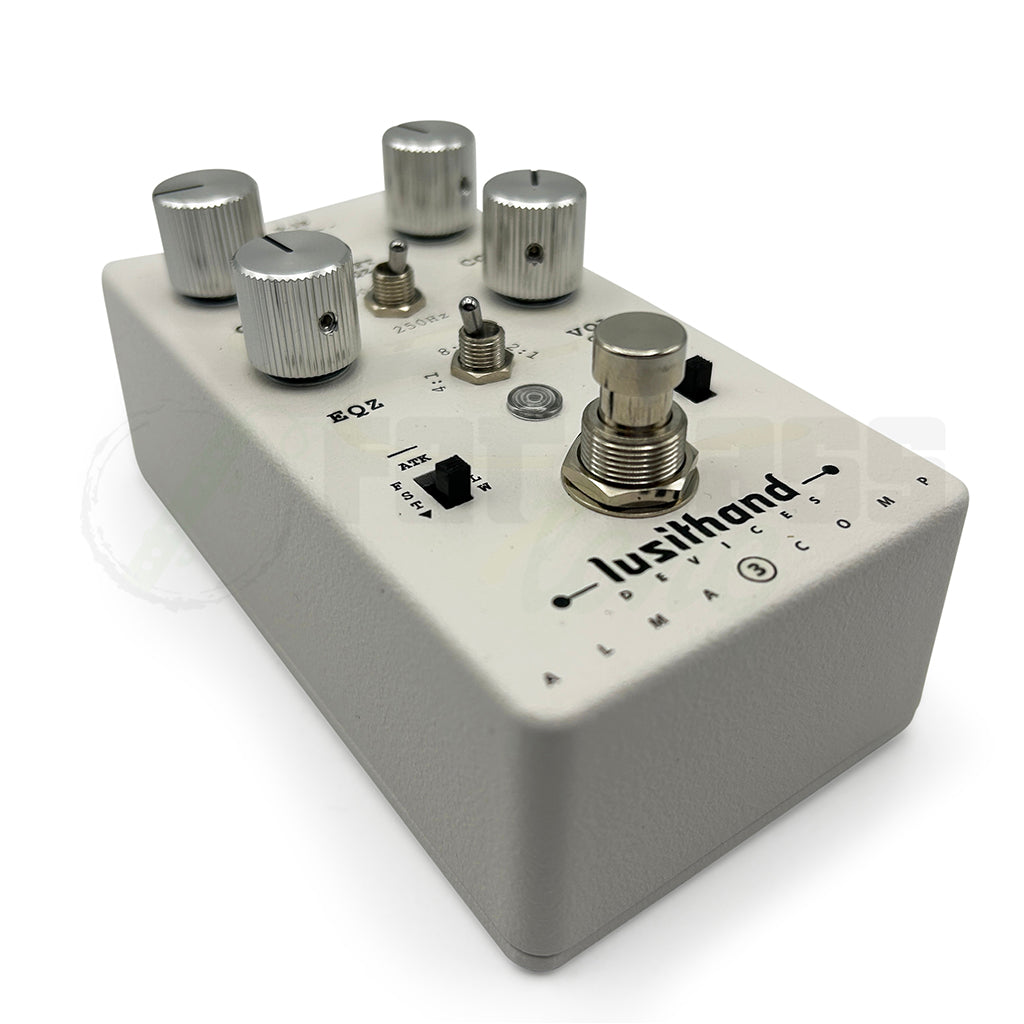 left side angular front photo of the Lusithand Alma MK3 Bass Compressor Pedal showing the ATK switch and the foot button