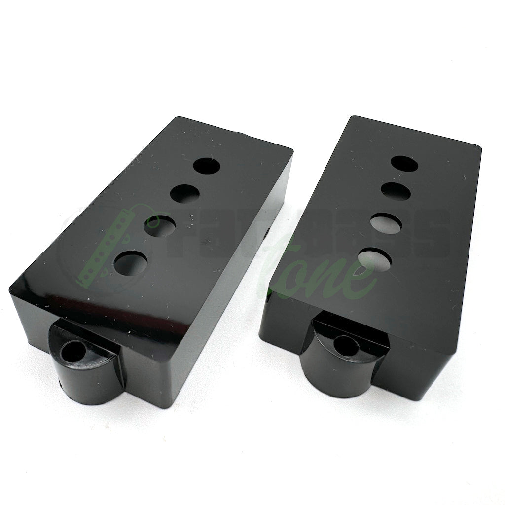 P Bass Pickup Covers in black showing the holes for the pole pieces