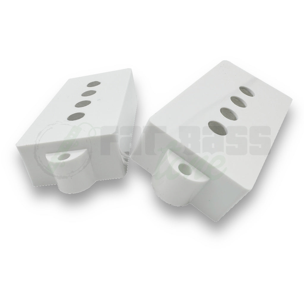 P Bass Pickup Covers in white showing holes for pole pieces