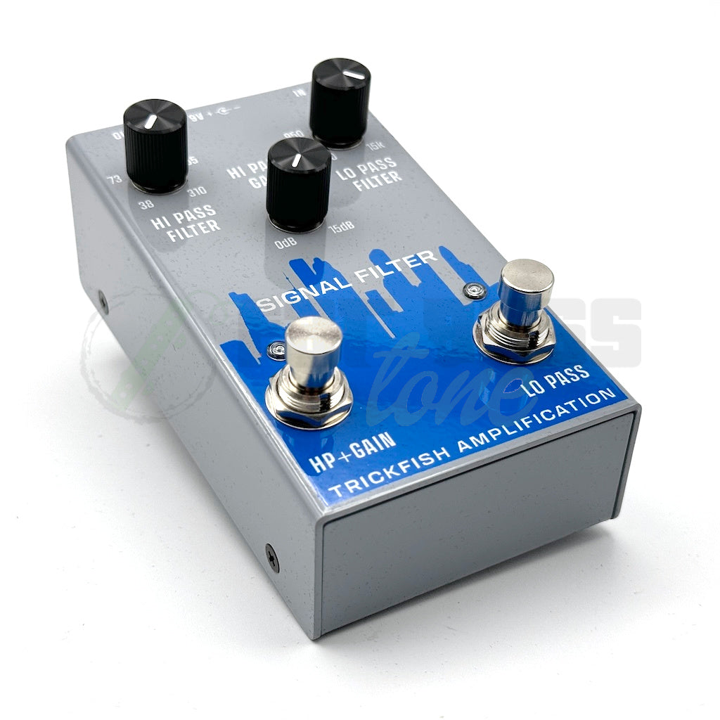 left view of the Trickfish Signal Filter Bass Pedal showing showing the city skyline in blue