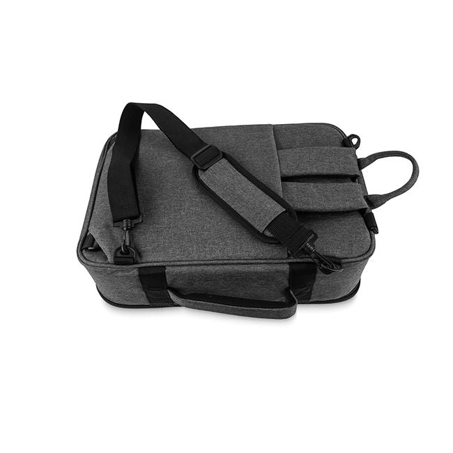 Back view of the Trickfish Bullhead Bass Amplifier Carrying Bag, showing the straps for using the bag like a backpack being stored in the sleeve, while using the shoulder strap for carrying.  