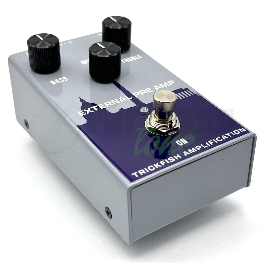 left front view of the Trickfish External Preamp (EPA) Bass Pedal showing the purple city skyline graphic